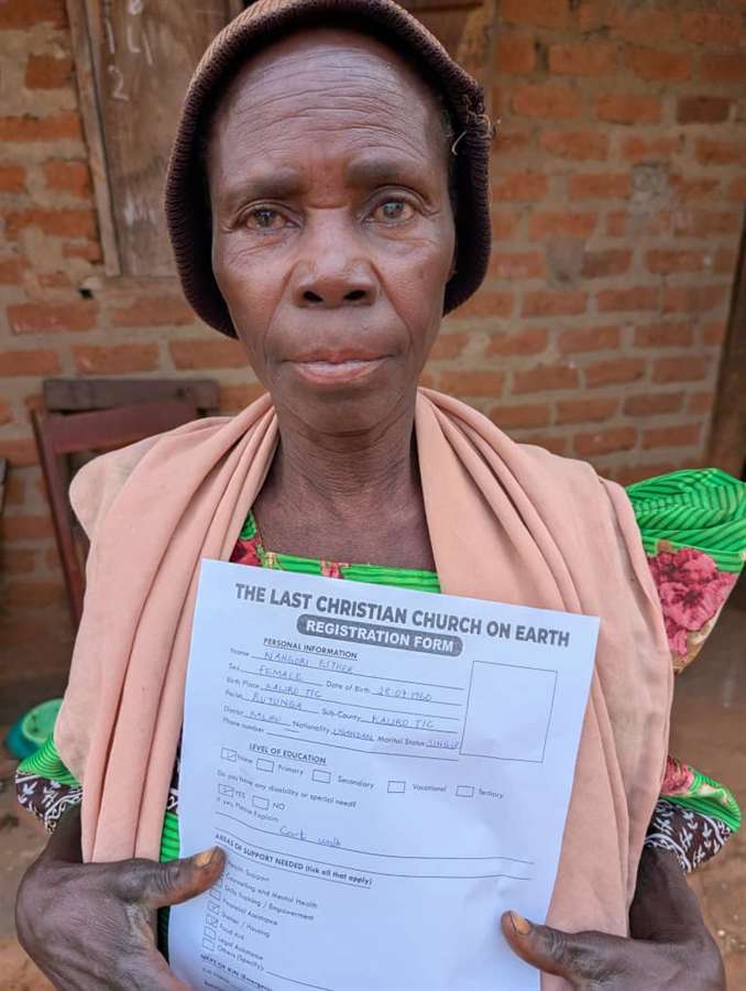A young man holding a signed request form.