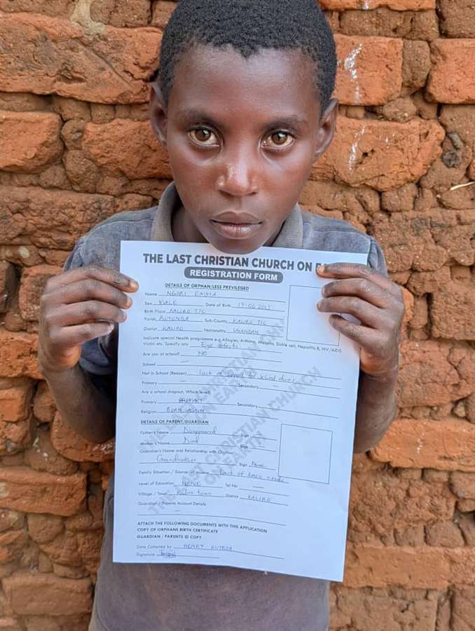 A smiling child holding a signed request form.